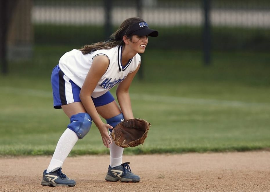 Girl playing softball coach