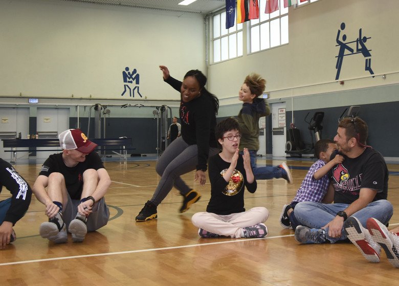 kids playing duck duck goose