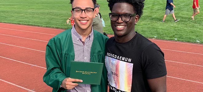 Brother congratulating graduation certificate 