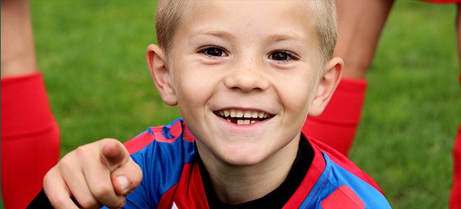 happy kid playing sports