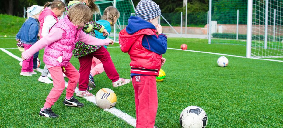 kids learning to play soccer